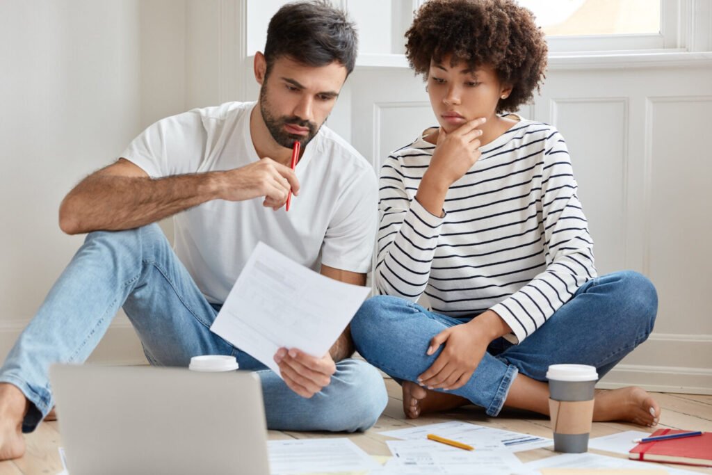 Man and woman looking at Housing Market and Mortgage Challenges
